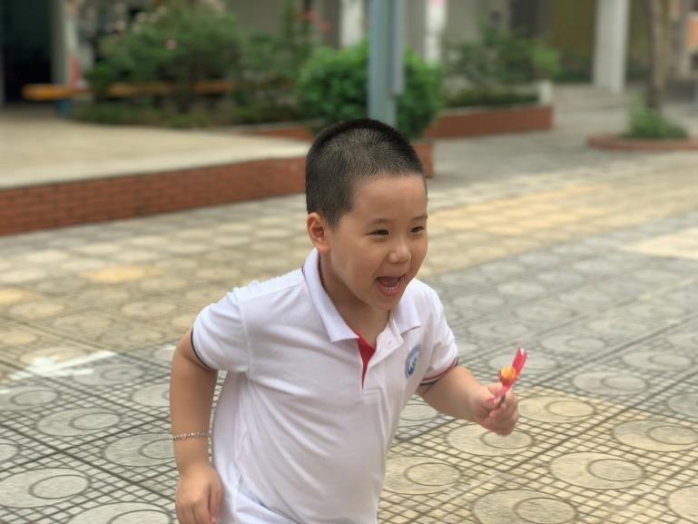 A picture containing ground, outdoor, person, child  Description automatically generated