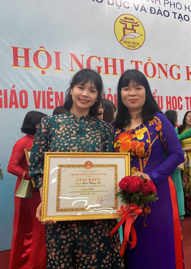 A picture containing text, person, standing, dressed  Description automatically generated