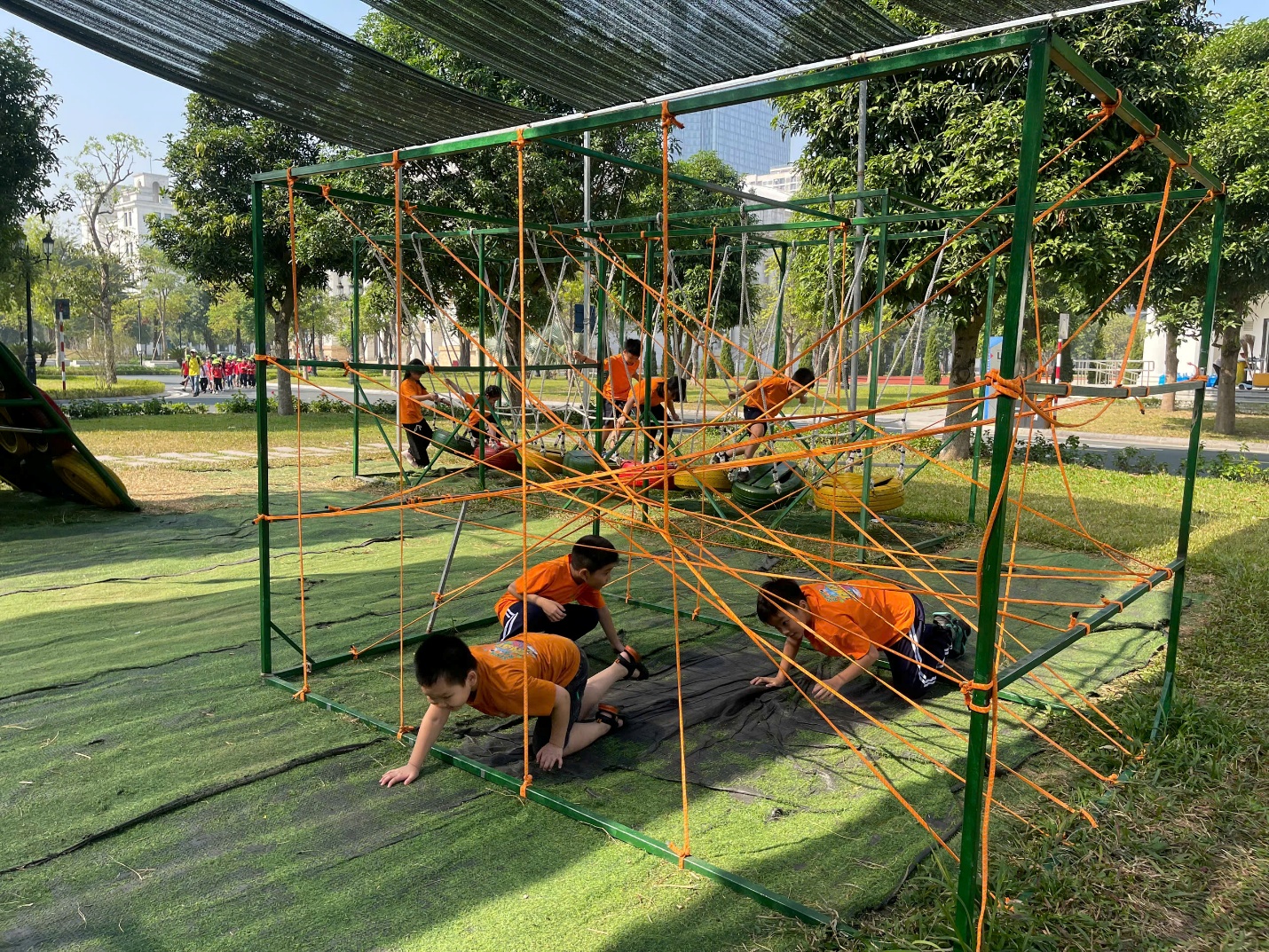 A group of kids playing in a playground

Description automatically generated