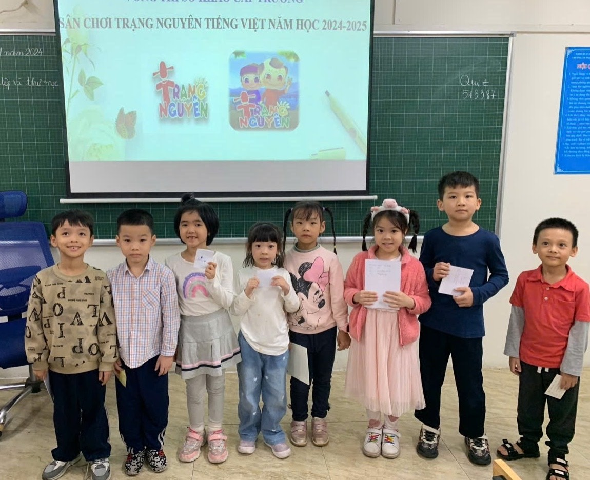 A group of children standing in front of a projector screen

Description automatically generated