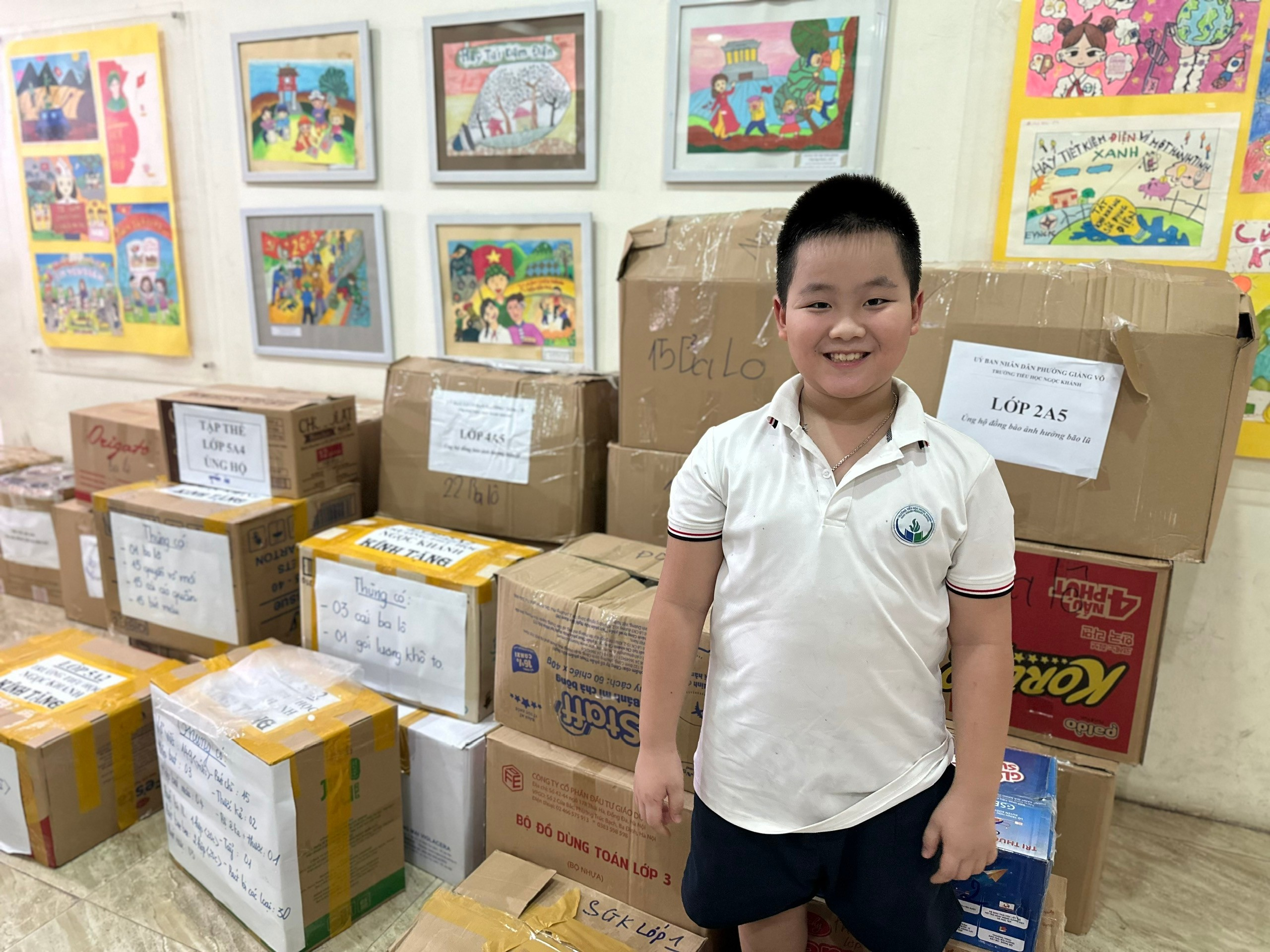 A child standing in front of a pile of boxes

AI-generated content may be incorrect.