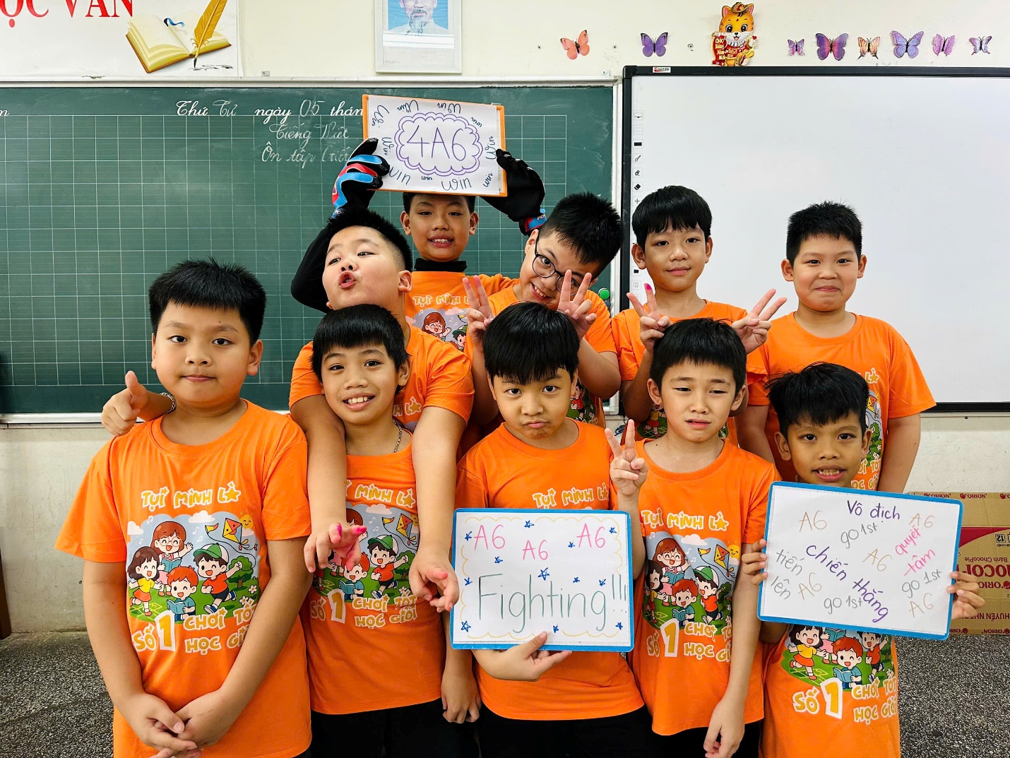 A group of children in orange shirts

AI-generated content may be incorrect.