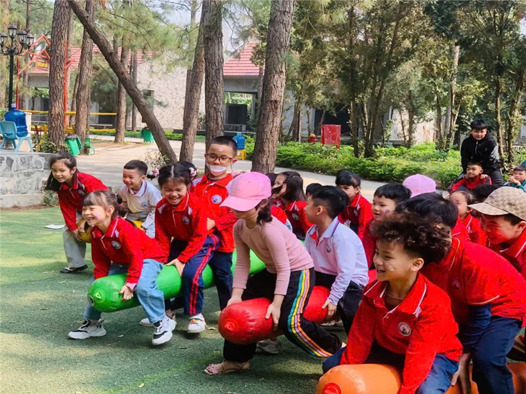 A group of children in red shirts

Description automatically generated