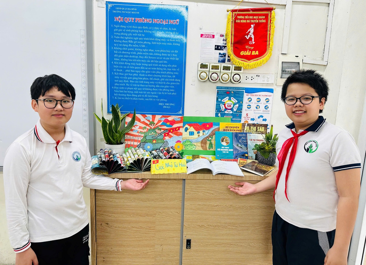 Two people standing next to a desk

AI-generated content may be incorrect.