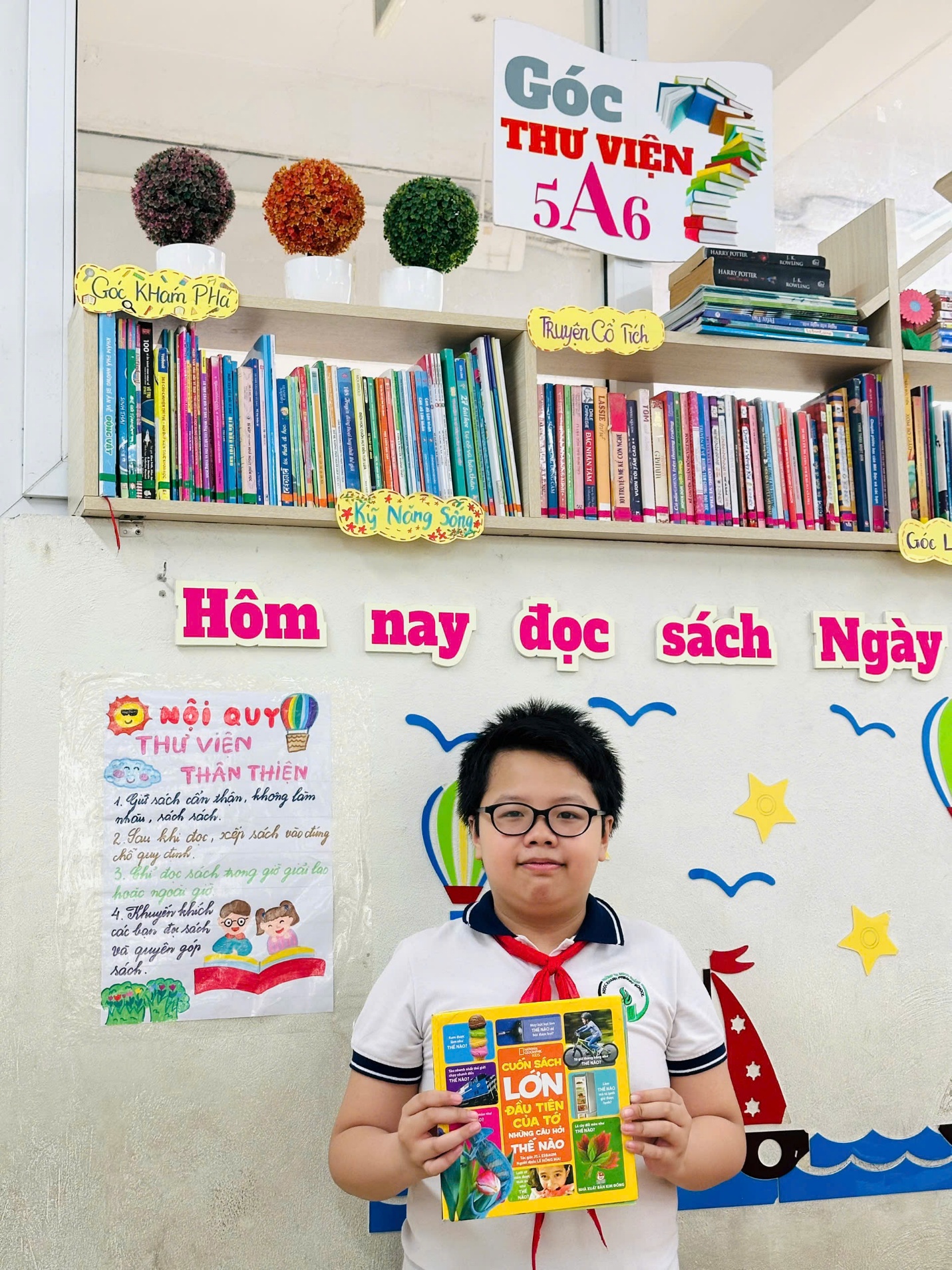 A child holding a book

AI-generated content may be incorrect.