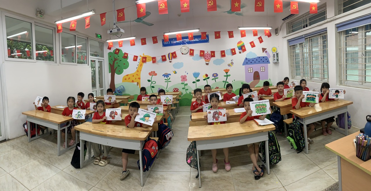 A group of children sitting at desks in a classroom

AI-generated content may be incorrect.