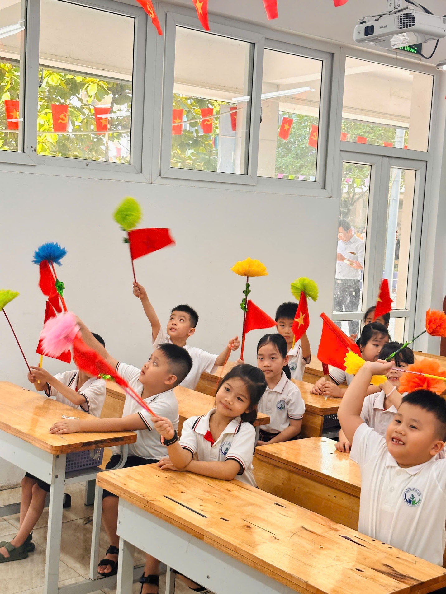 A group of children in a classroom
Description automatically generated