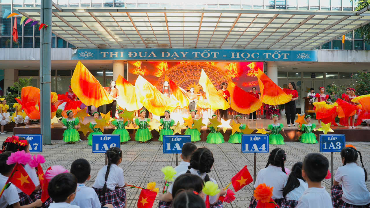 A group of children performing on stage
Description automatically generated