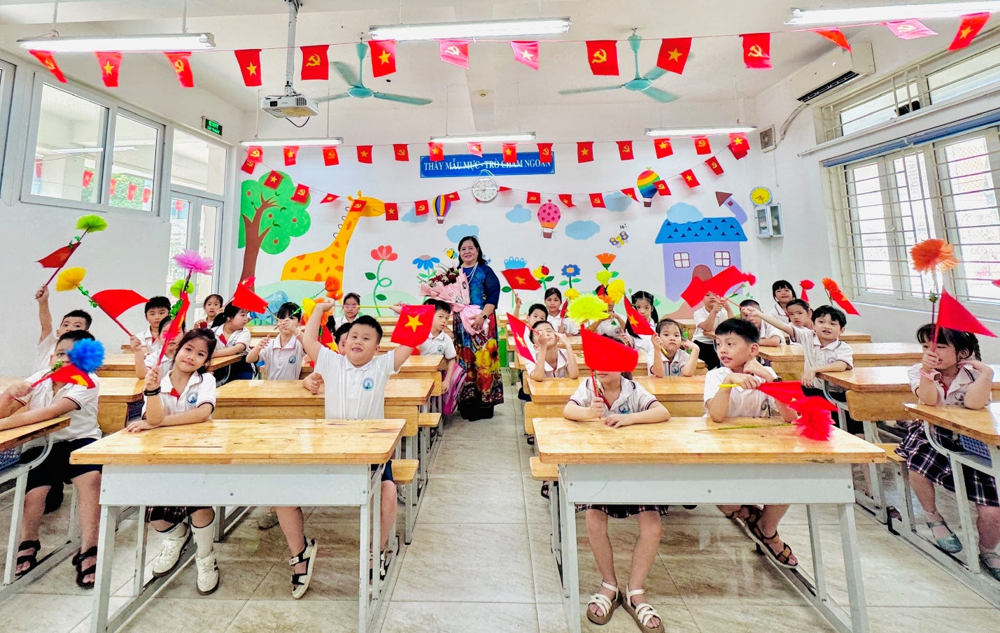 A group of children in a classroom
Description automatically generated