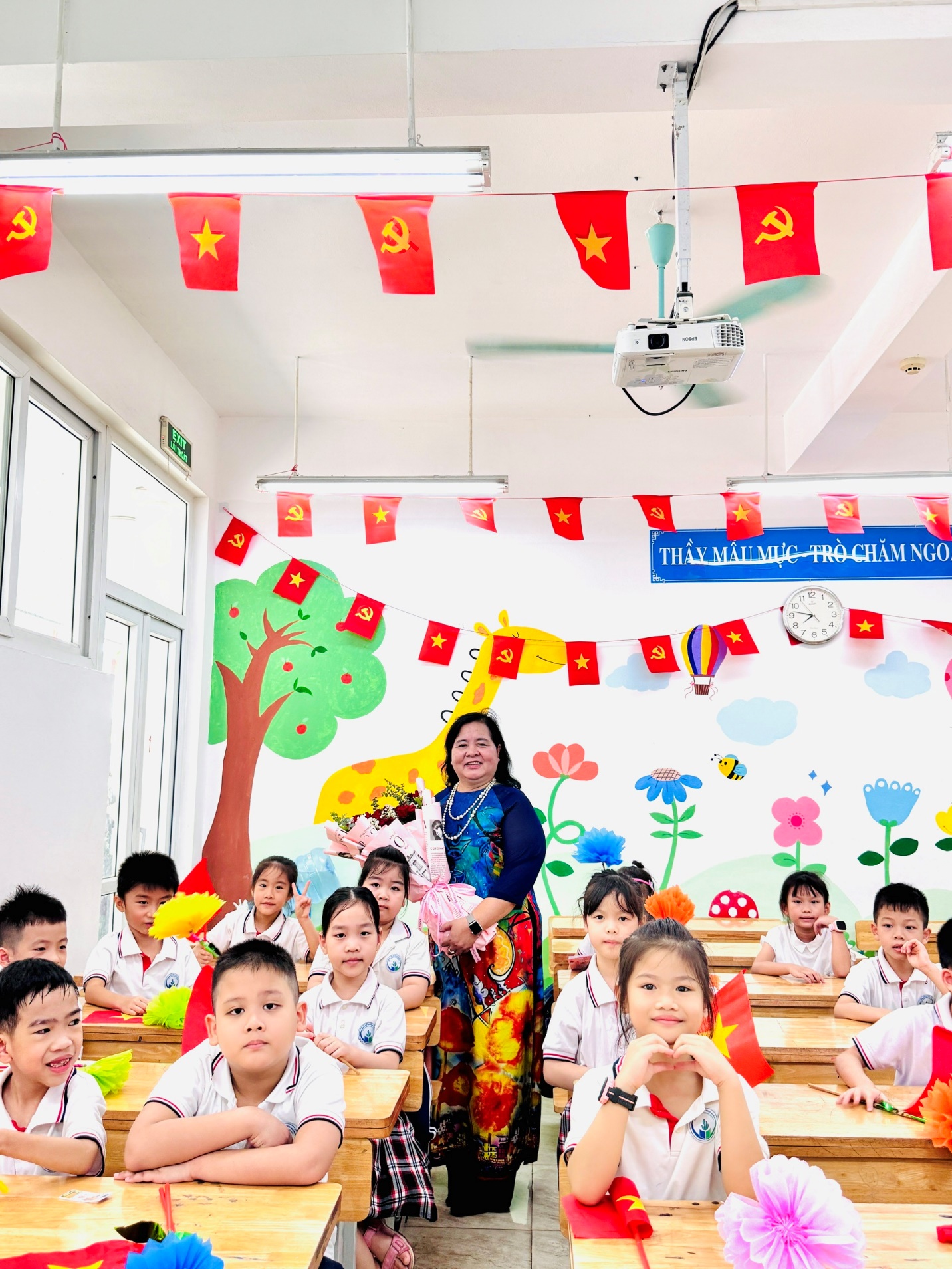 A group of children in a classroom
Description automatically generated